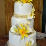 wedding cake, white wedding cake with yellow flowers, wedding cake with cala lilies and day lilies, beautiful wedding cakes